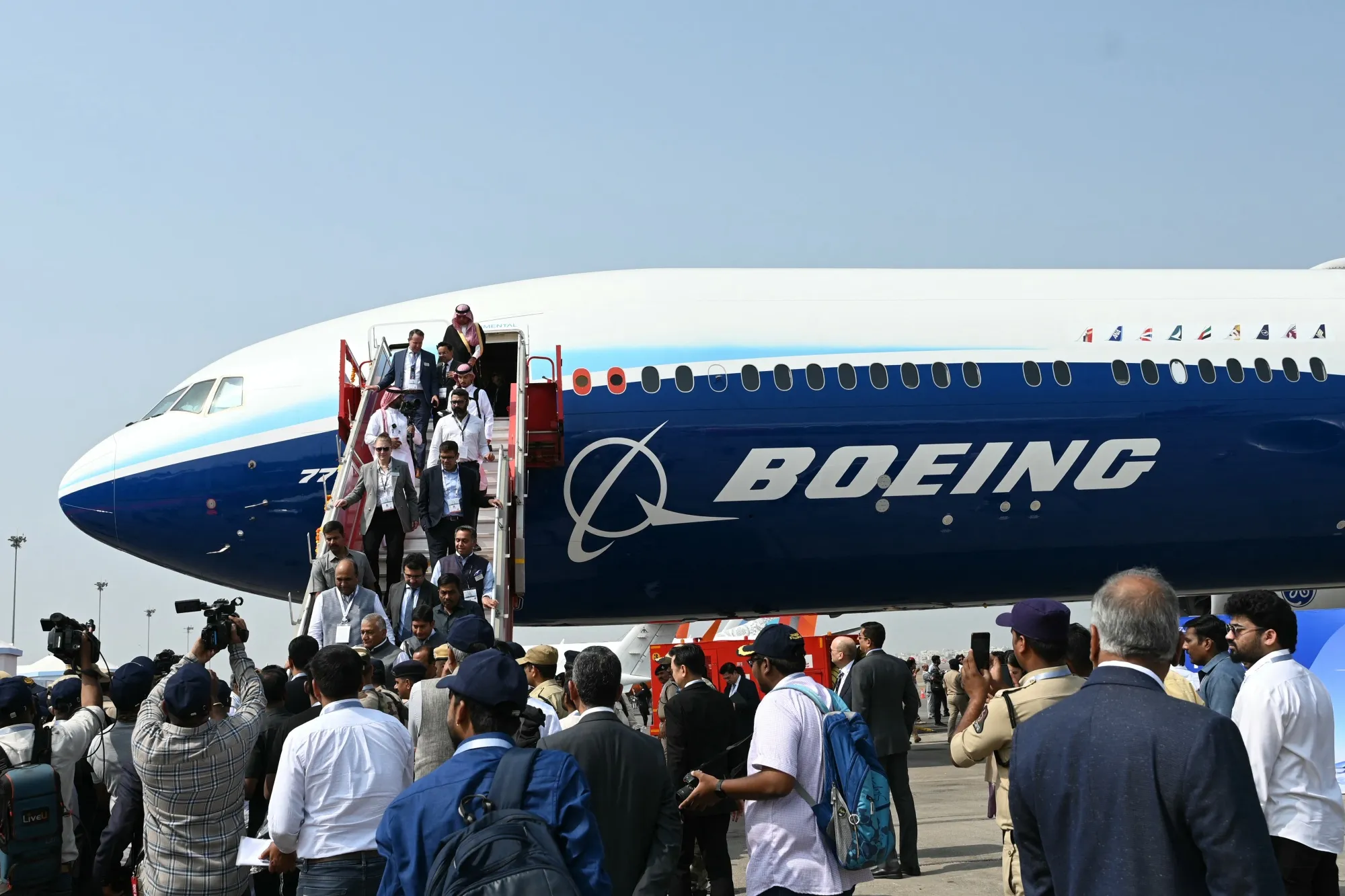 Visitors gathered near a Boeing 777X aircraft displayed during the 'Wings India 2024' at the Begumpet Airport in Hyderabad on Jan. 18.