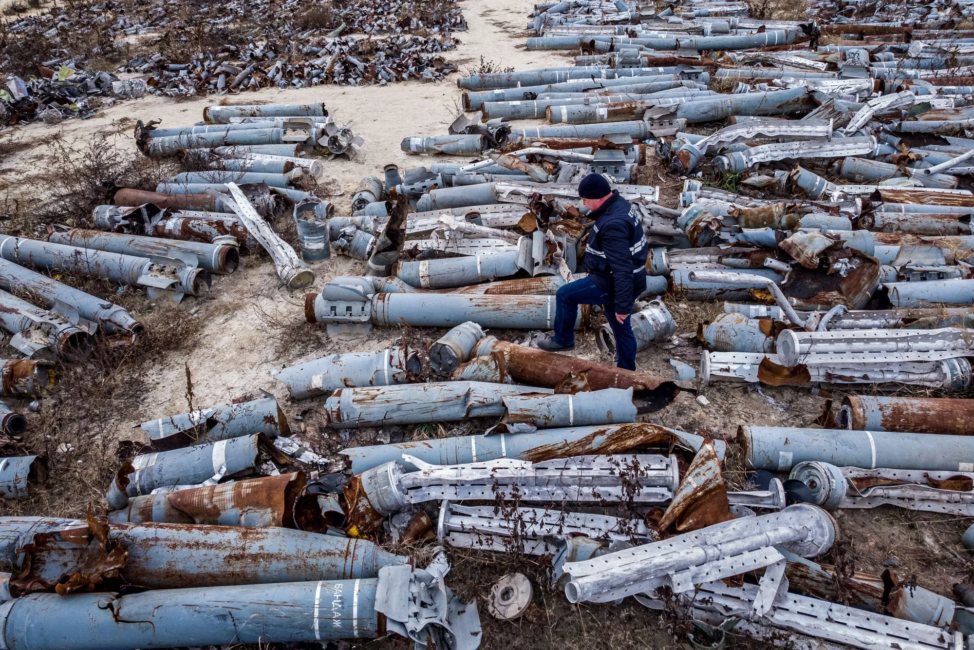 A person examines collected remnants of shells and missiles used by the Russian army to attack&nbsp;Kharkiv,&nbsp;Ukraine.&nbsp;