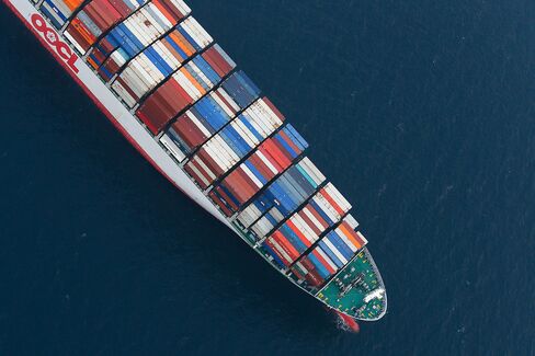An Orient Overseas Container Line (OOCL) container ship waits to unload cargo in this aerial photograph taken above the Port of Los Angeles.