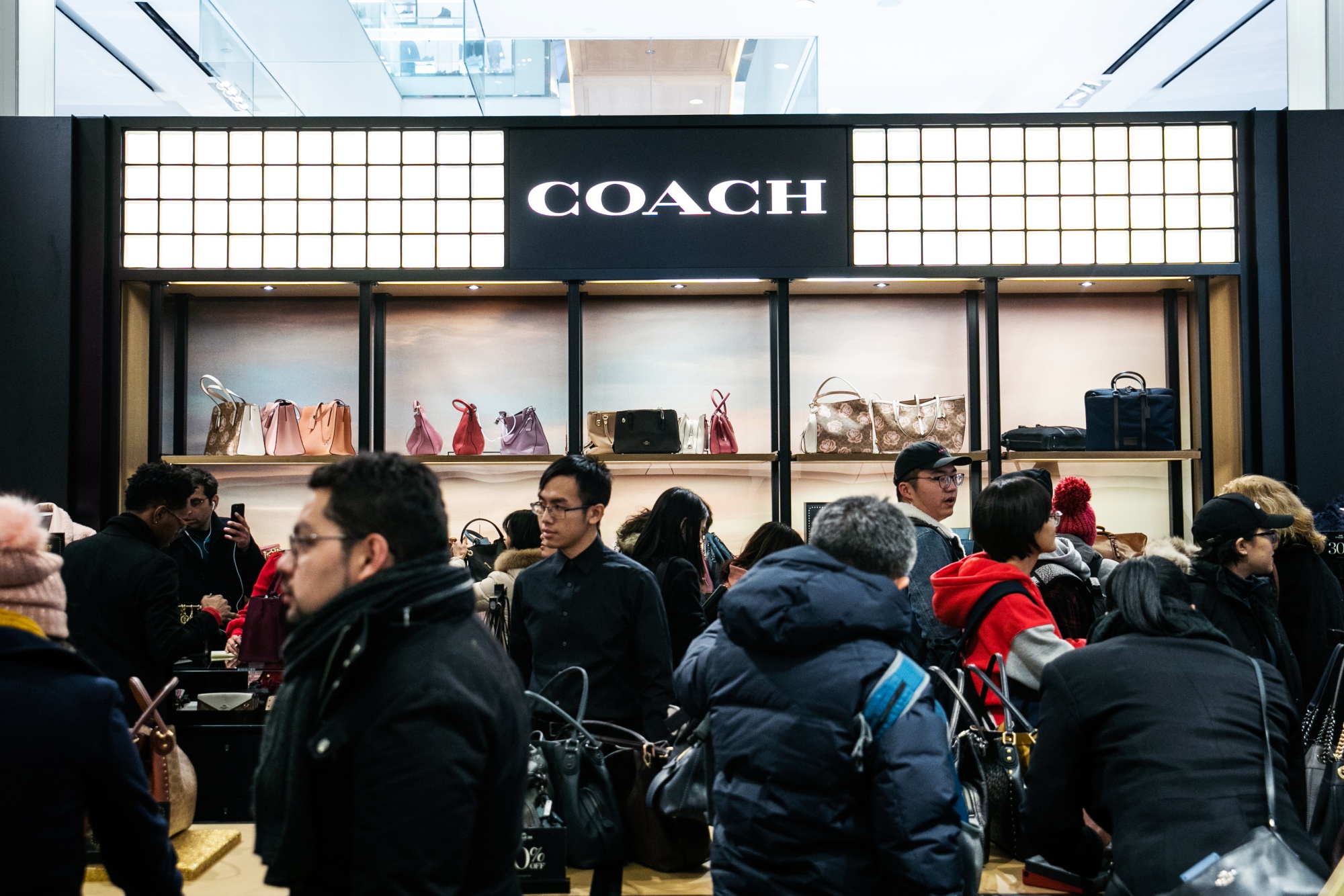 Coach owner Tapestry cuts forecast, shares dive