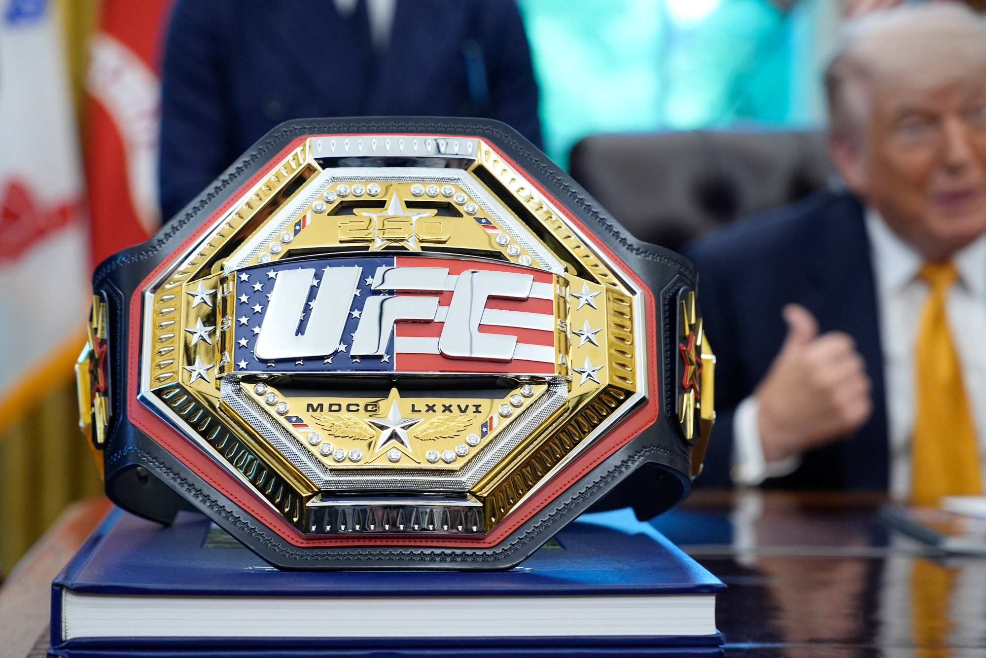 A UFC champion belt as US President Donald Trump speaks in the Oval Office of the White House in Washington, DC, US, on Wednesday, May 6, 2026. President Trump will host a UFC fight on the South Lawn of the White House in June, as part of a series of events held throughout 2026 to celebrate the country's 250th anniversary. Photographer: Yuri Gripas/Abaca/Bloomberg