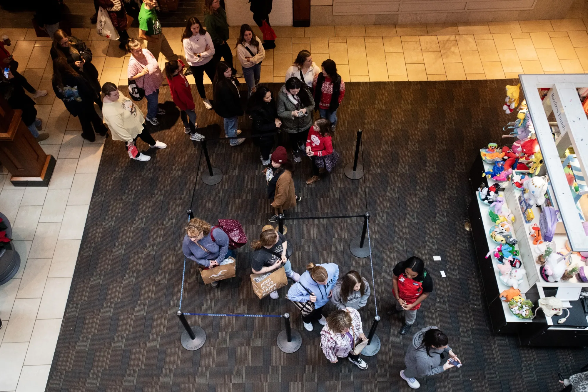 Shoppers wait in line outside a store at a&nbsp;mall on in Columbus, Ohio.