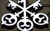 A company logo hangs outside the entrance of UBS Group AG's headquarters in Zurich, Switzerland, on Thursday, July 23, 2015. UBS Group AG and Morgan Stanley increased the assets they manage for the world's wealthiest people to more than $2 trillion for the first time, according to a study.