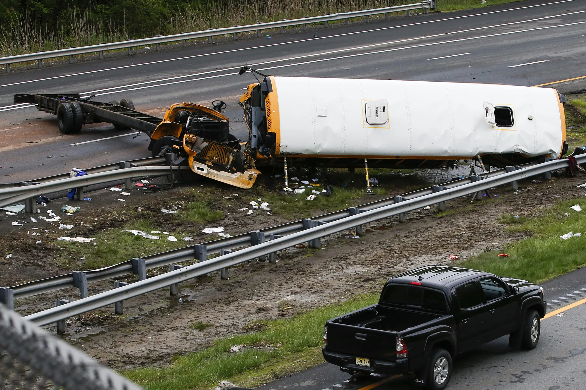 A destroyed school bus lies on Interstate 80 following an accident on May 17, 2018 in Mount Olive Township, New Jersey.&nbsp;