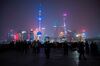 The skyline of the Lujiazui Financial District in Pudong, Shanghai is seen moments before its lights turned off for the Earth Hour environmental campaign on March 25, 2017. / AFP PHOTO / Johannes EISELE (Photo credit should read JOHANNES EISELE/AFP/Getty Images)