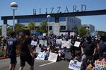 Employees gather for a group photo during a walkout at Activision Blizzard offices in Irvine, California on July 28.