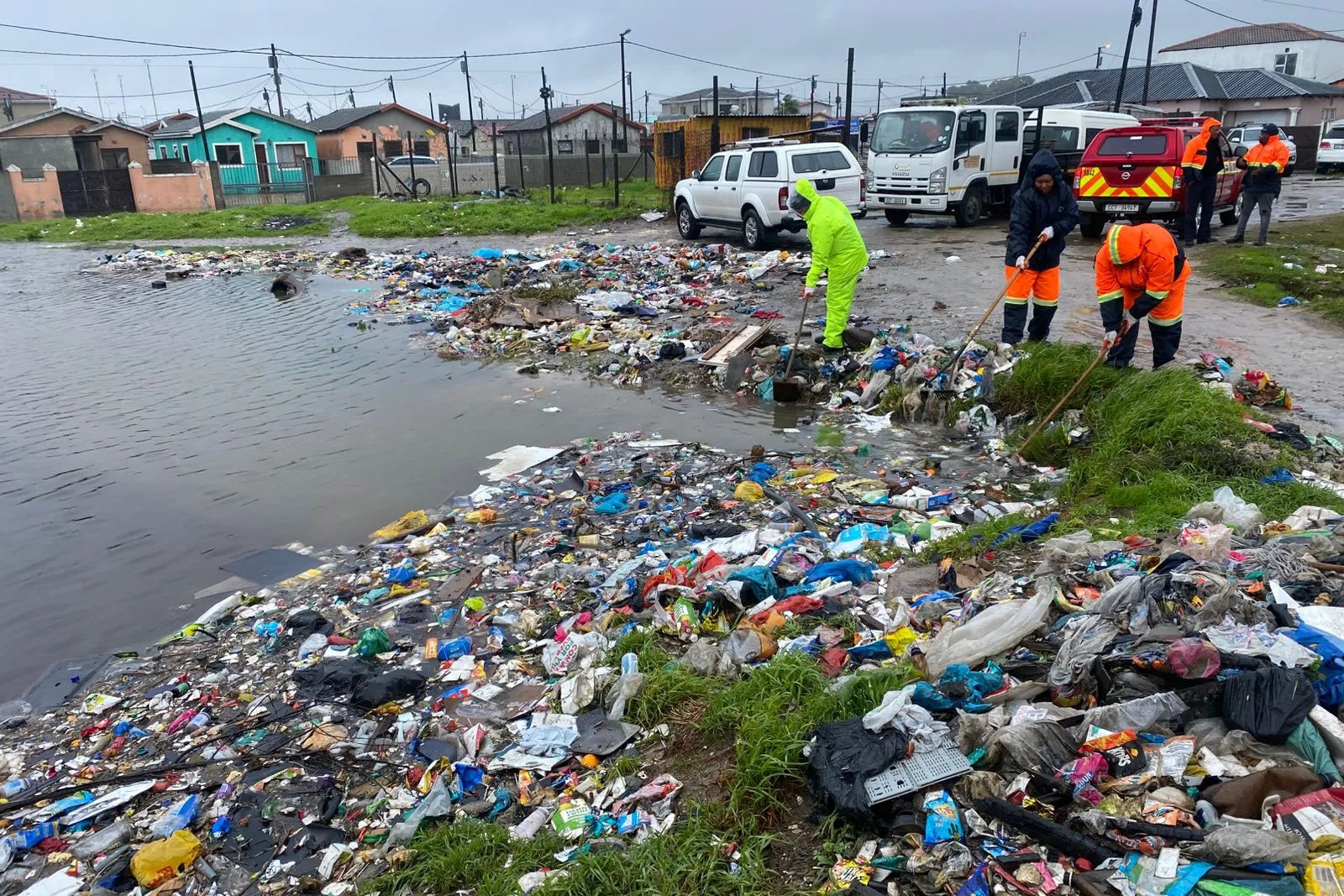 Municipal workers clear debris following flooding in Cape Town, in a photo released by the City of Cape Town, on May 12.