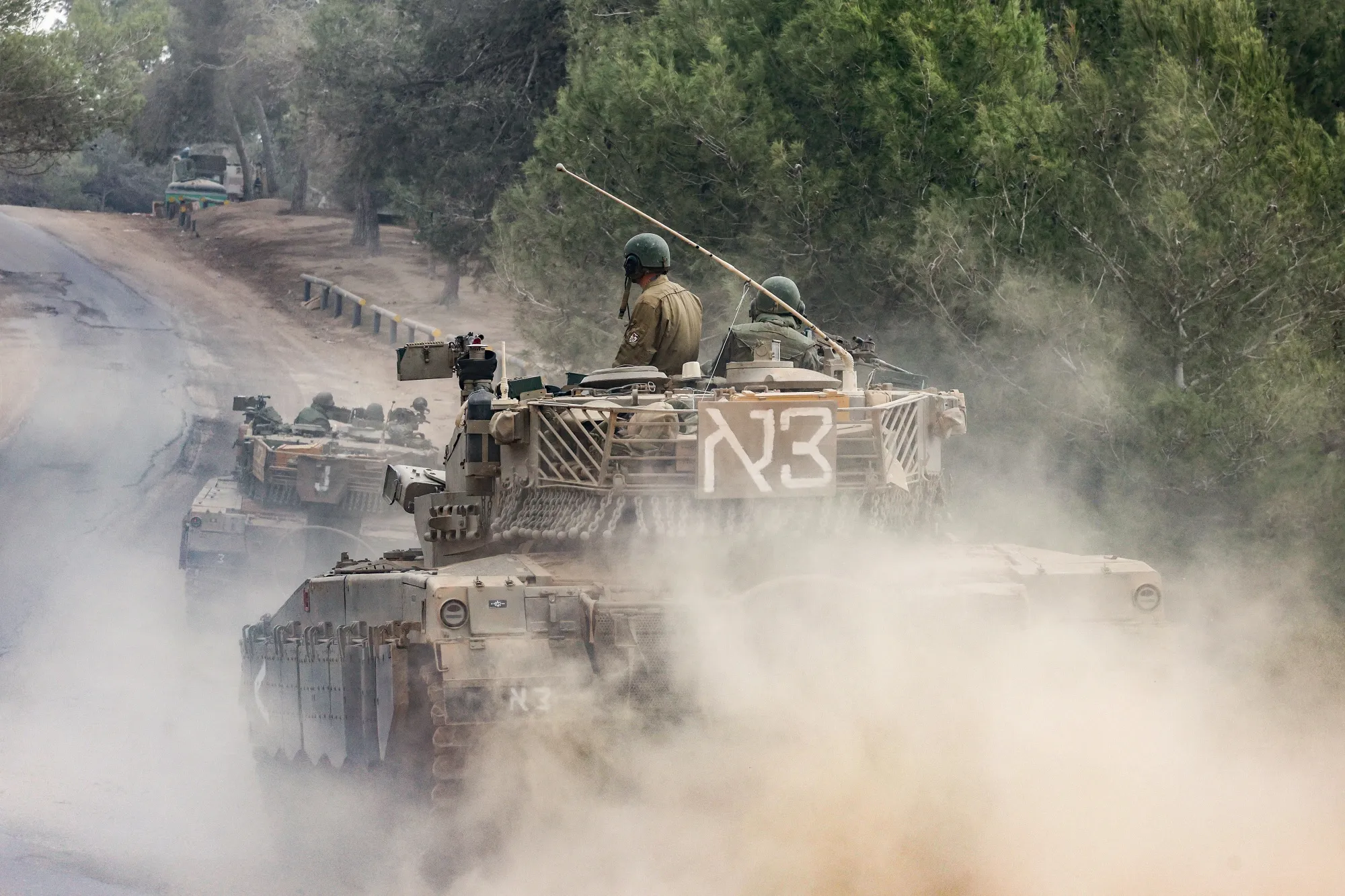 Israeli military tanks roll near the border with the Gaza Strip on Dec. 5.