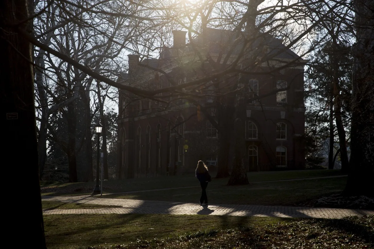A student walks near Brooks Hall on the University of Virginia&nbsp;campus in Charlottesville, Virginia.