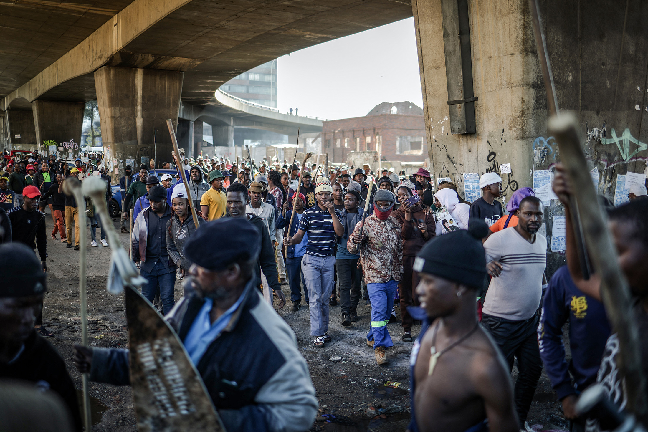 Protesters march during a demonstration marking an unofficial deadline set by citizen-led groups for undocumented foreign nationals to leave South Africa, in Johannesburg, on June 30.
