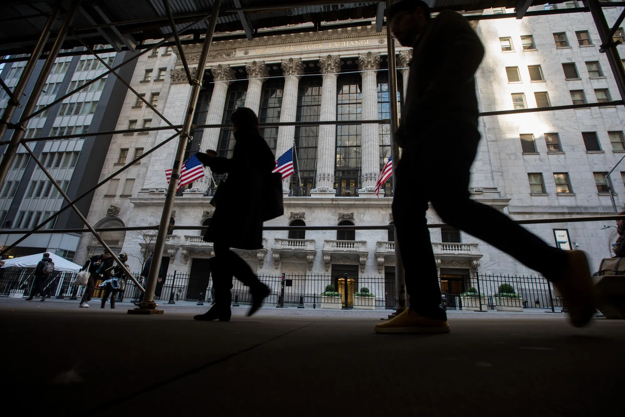 Pedestrians pass in front of the New York Stock Exchange&nbsp;in New York.