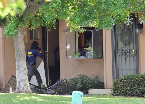The FBI searches the San Bernardino shooter's home in Redlands, Calif. on Dec. 3, 2015.