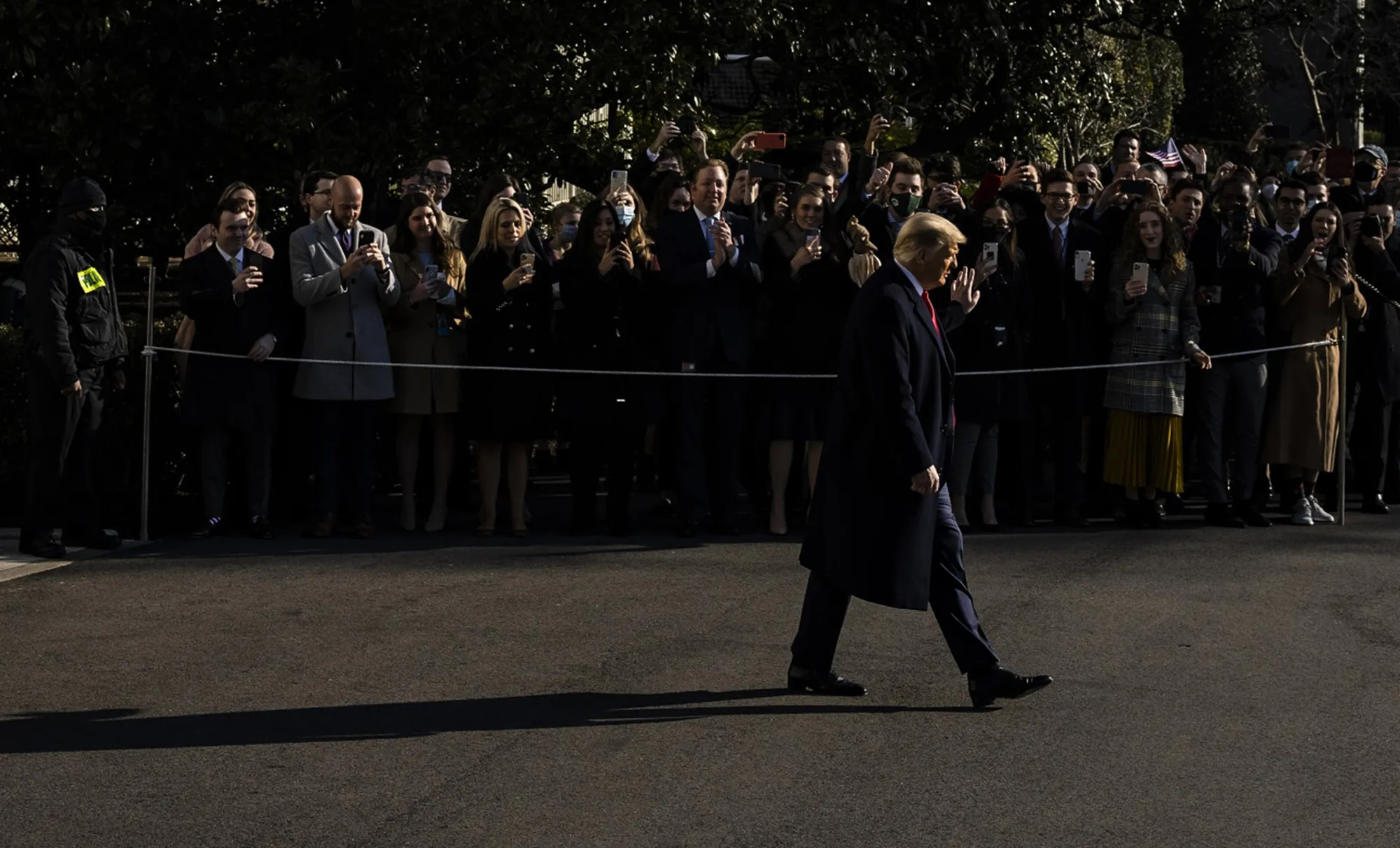 Donald Trump waves to people while departing the White House in Washington on&nbsp;Jan. 12.
