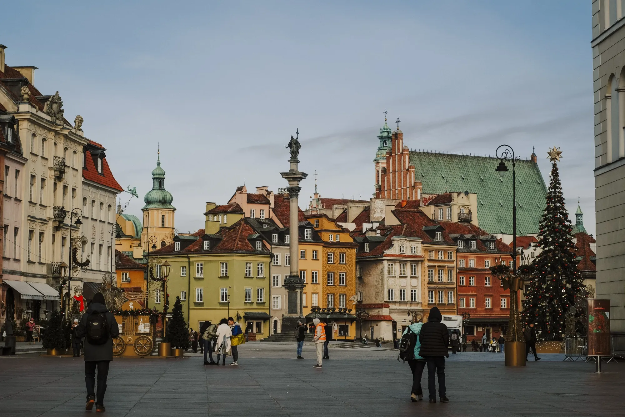 Visitors at Castle Square in the old town in Warsaw, Poland.