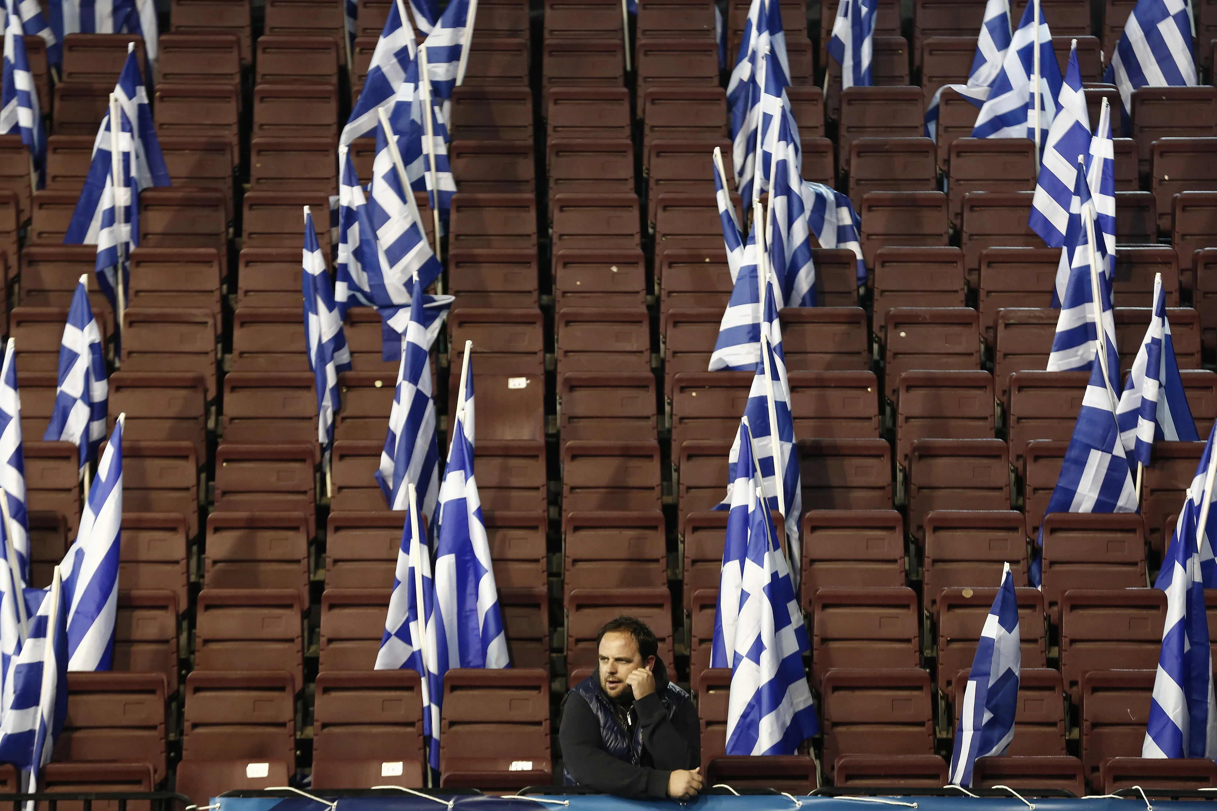 A supporter of the New Democracy party before a pre-election rally by the party leader and Greek Prime Minister Antonis Samaras, in Palaio Faliro, near Athens on Jan. 23, 2015.
