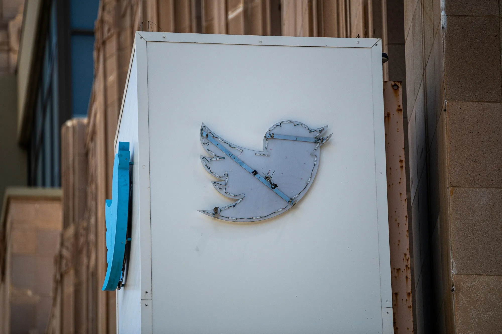 A partially removed sign at what was then-Twitter headquarters in San Francisco in 2023 after&nbsp;Elon Musk changed the company’s name and logo to X.

Photographer: David Paul Morris/Bloomberg