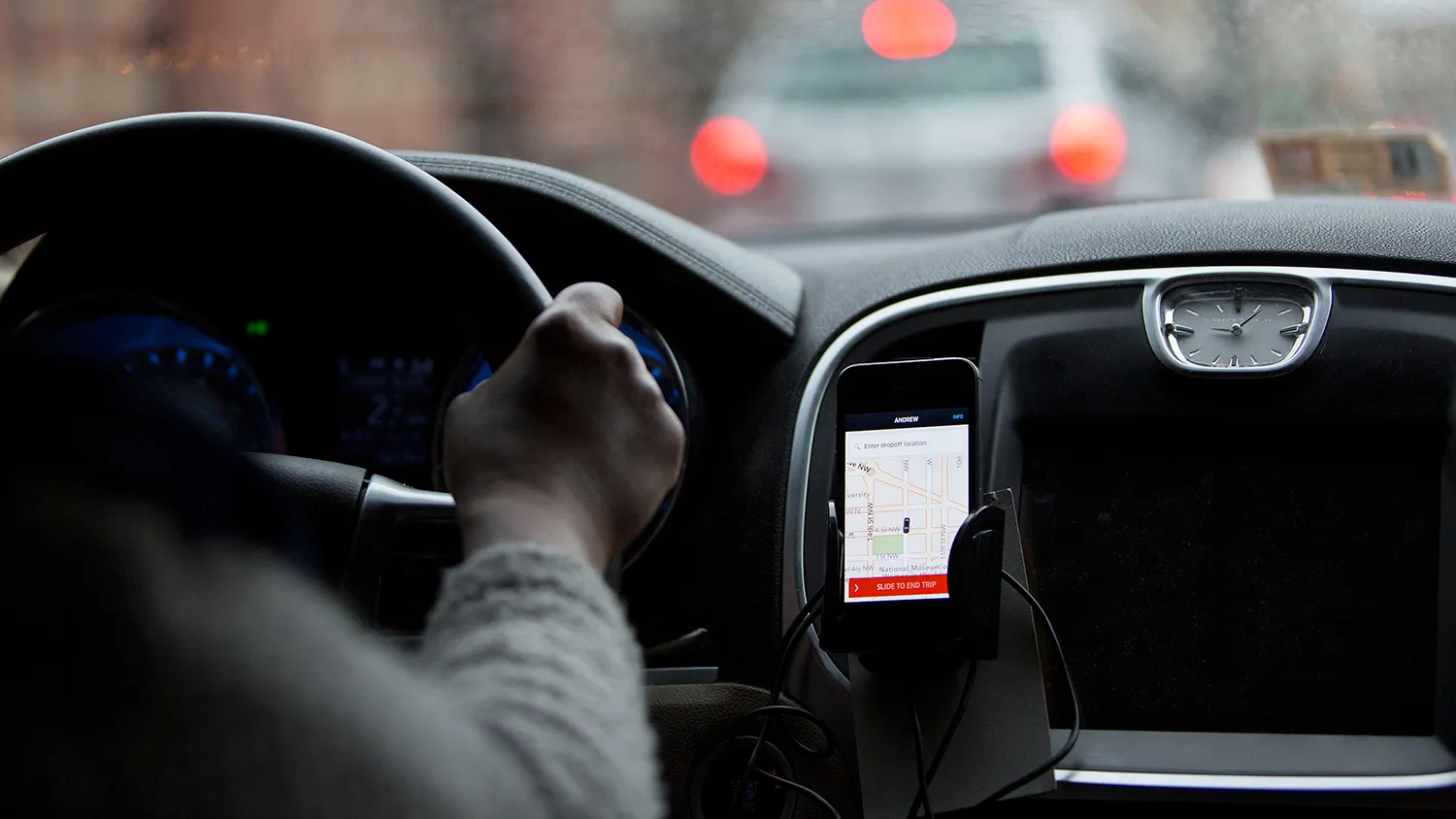 The Uber app runs on an iPhone during an Uber ride in Washington on April 8, 2015.
