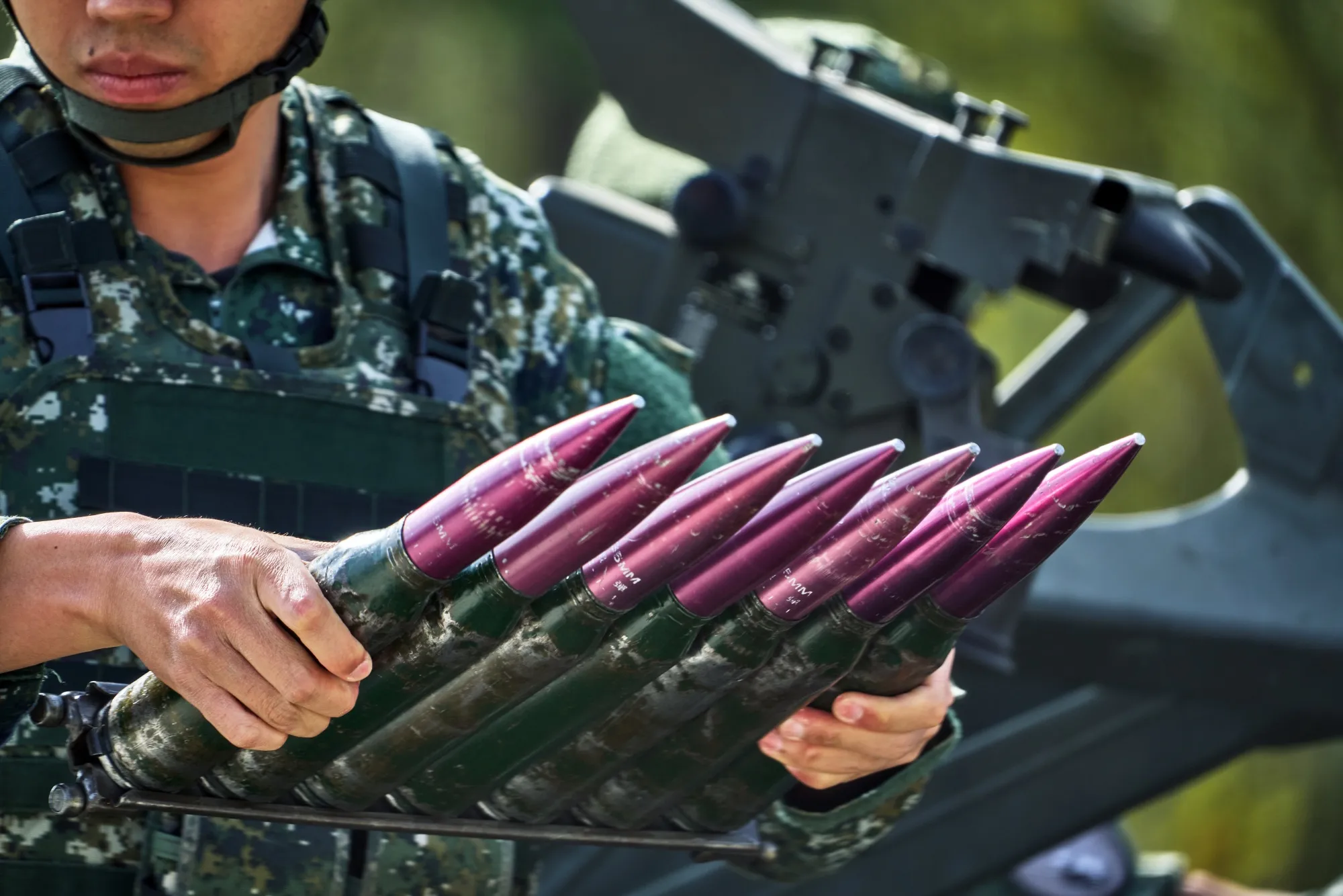 A Taiwanese Air Force soldier holds ammunition for an anti-aircraft gun during a military exercise at the Chiayi Air Force Base.