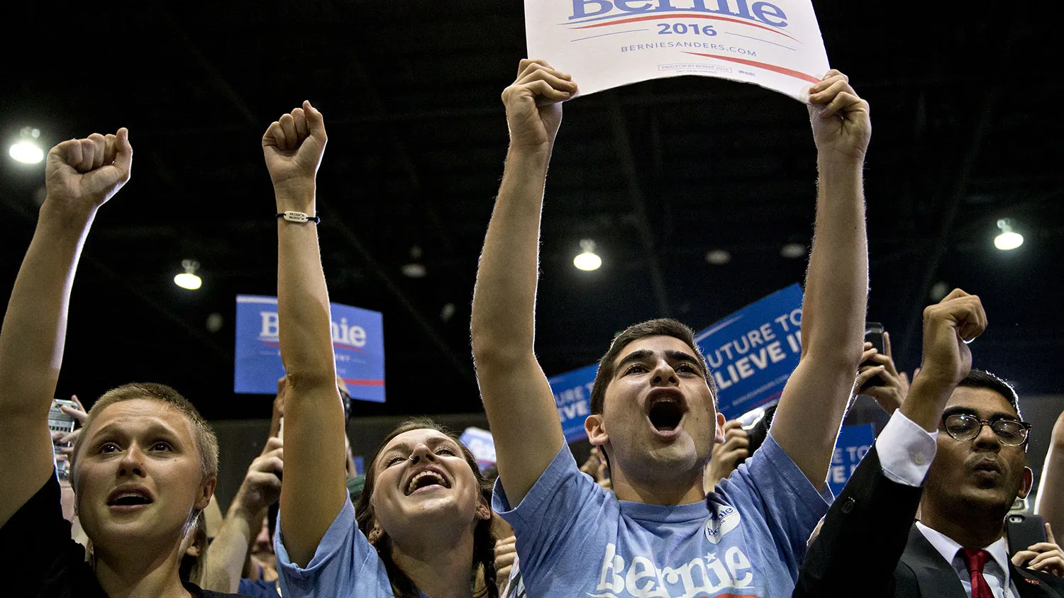 An attendee holds a campaign sign in support of Senator Bernie Sanders in Tampa, Florida, on March 10, 2016.
