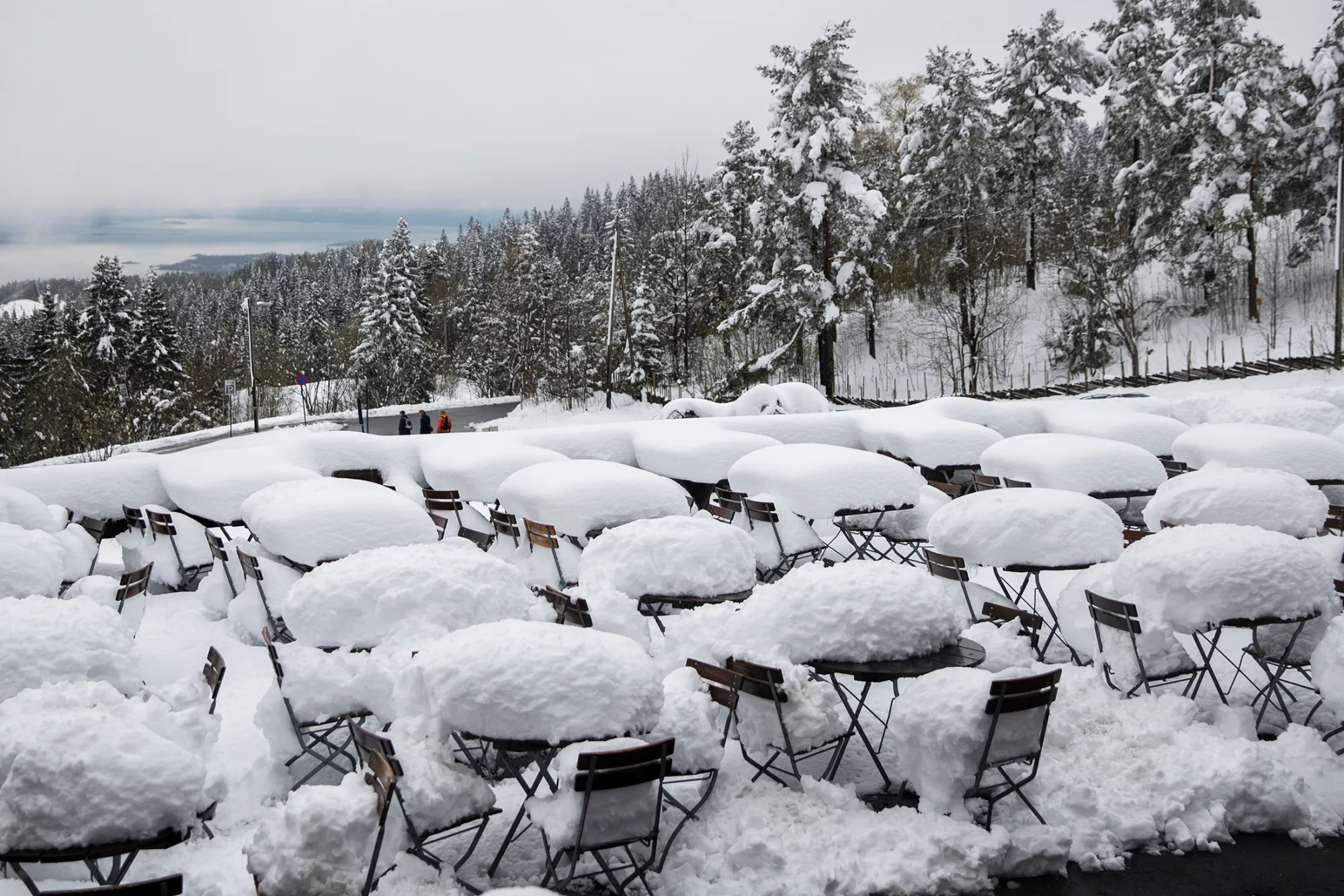 Snow covers an outdoor cafe in Holmenkollen, Oslo, Norway, on May 11, 2017.
