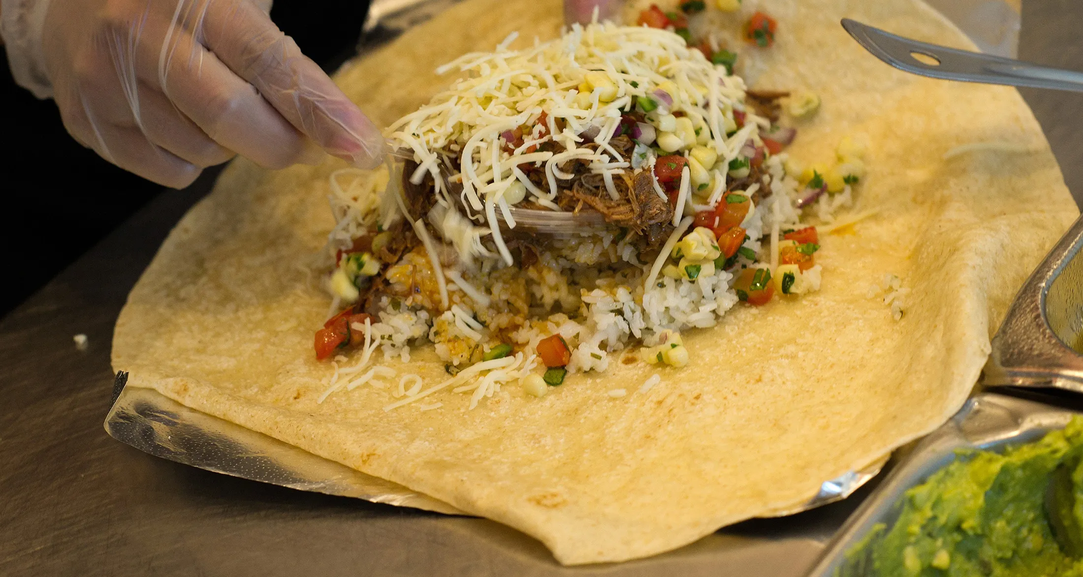 CHIPOTLE MEXICAN GRILL INC. EARNS