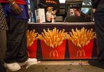 Customers order from a walk up window at a McDonald's Corp. restaurant on 42nd Street in Times Square in New York.