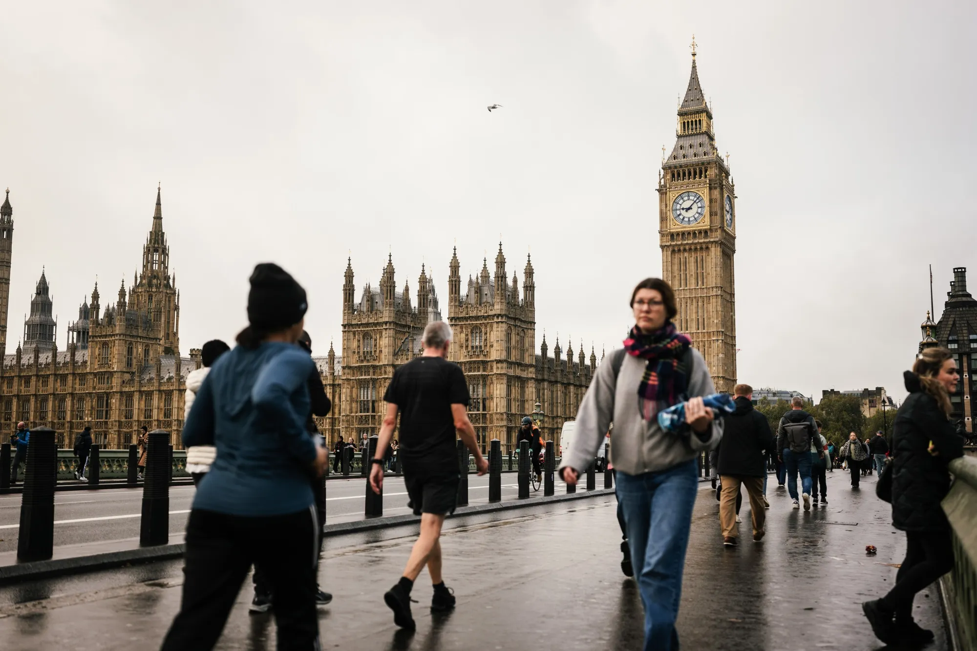 Commuters cross Westminster Bridge in London.