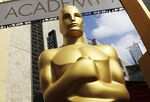 In this Feb. 21, 2015 file photo, an Oscar statue appears outside the Dolby Theatre for the 87th Academy Awards in Los Angeles. (Photo by Matt Sayles/Invision/AP, File)