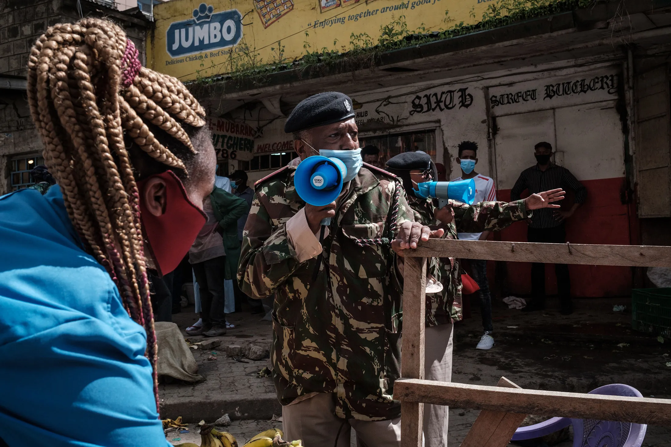 Police officers request all street vendors to close and leave to curb the spread of Covid-19 in Nairobi, Kenya, on April 24.