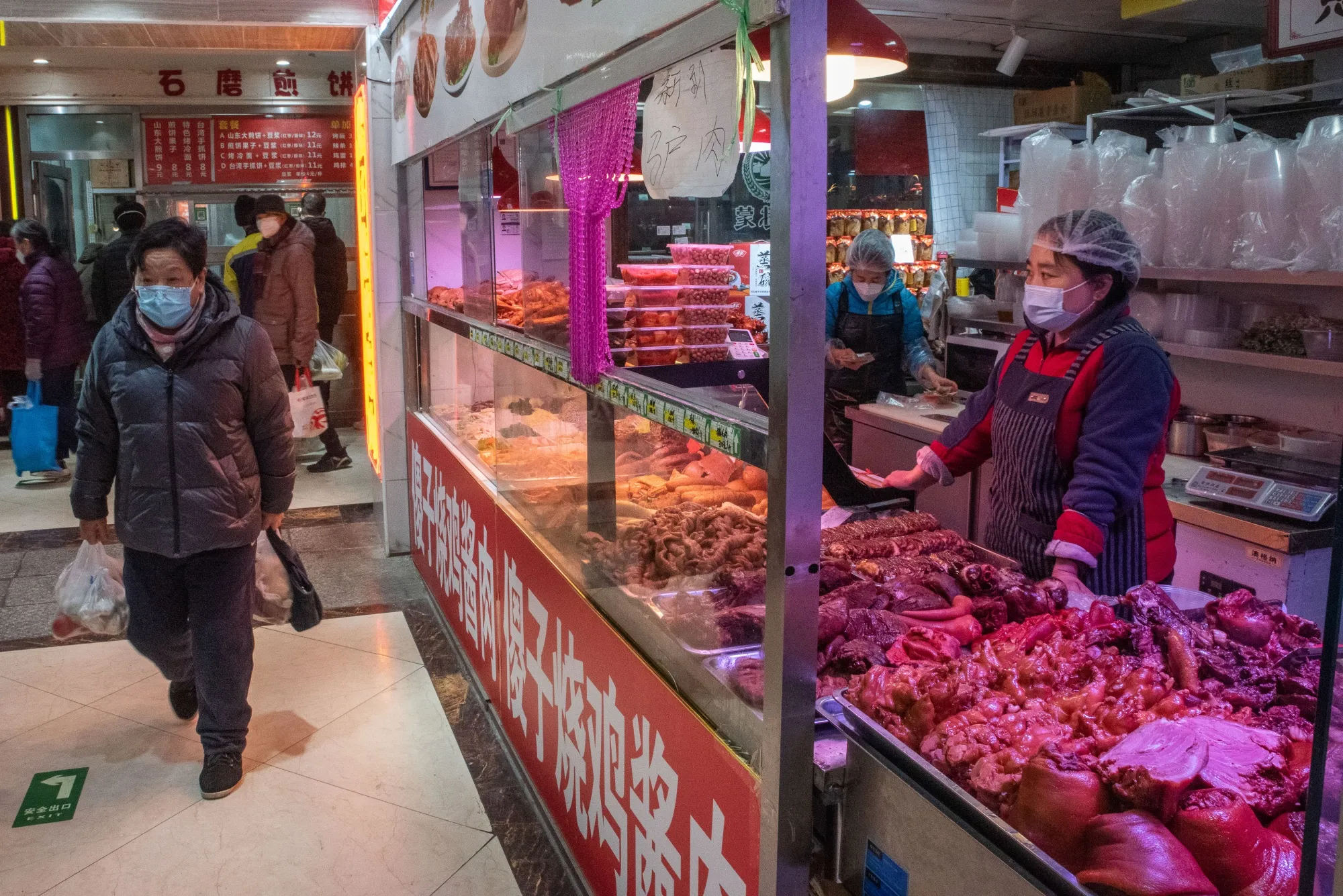 Cooked pork dishes for sale at a food stall in Beijing, China, on Thursday, Jan, 12, 2023.&nbsp;