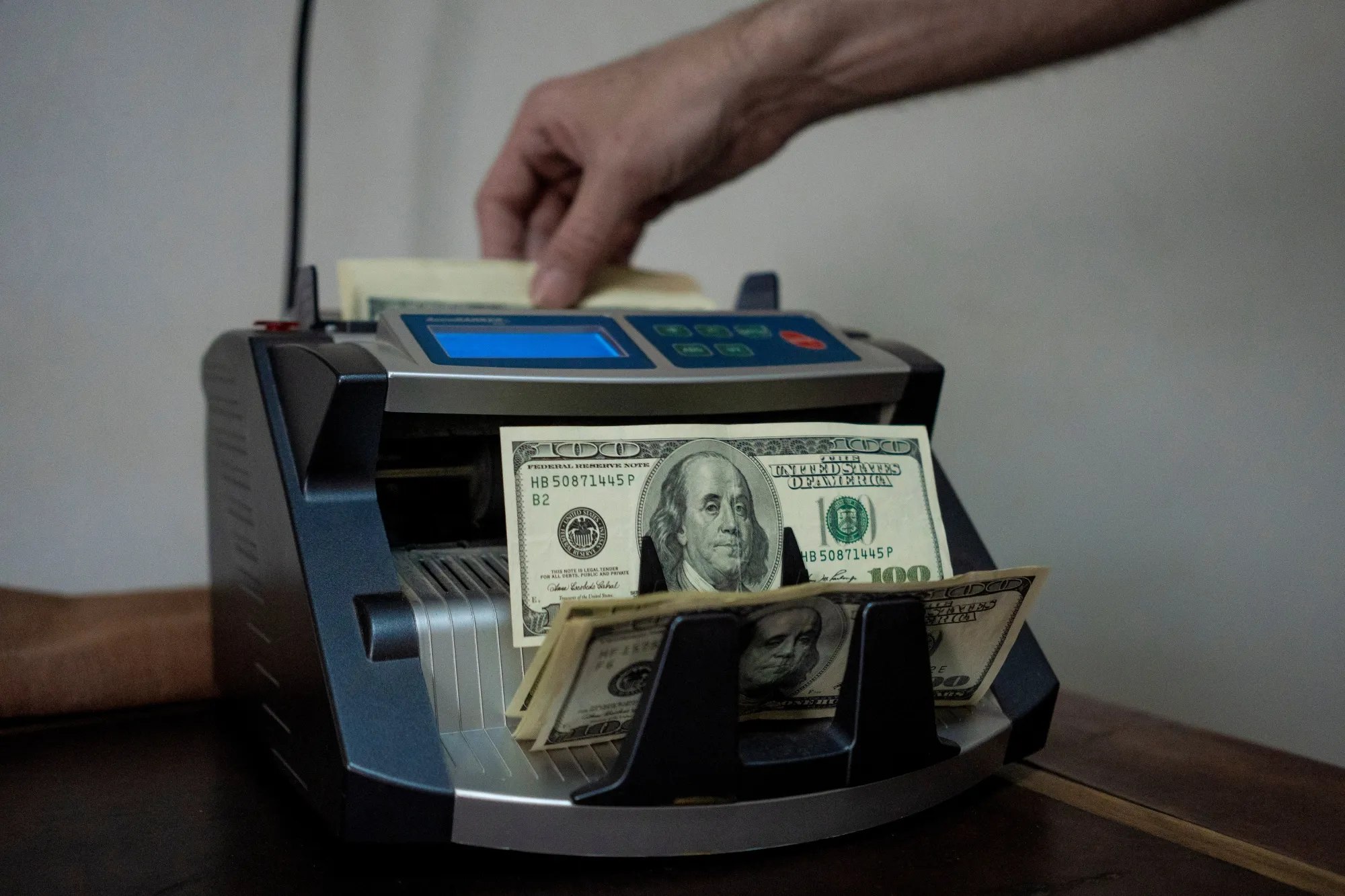 US cash is counted at a currency exchange house in Buenos Aires.