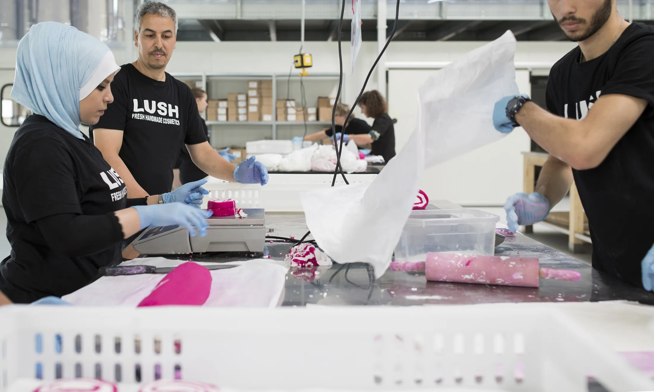 An employee weighs slices of 'The Comforter' bubble bath roll during manufacture at the Lush Cosmetics Ltd. hand made cosmetics factory in Duesseldorf, Germany, on July 19, 2016.
