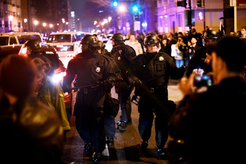 Riot police push back protesters from an inaugural ball venue after the swearing in of U.S. President Donald Trump in Washington January 20, 2017.