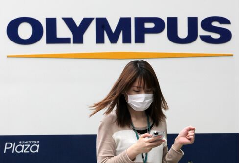 Olympus Gains After Raising Net Income Forecast