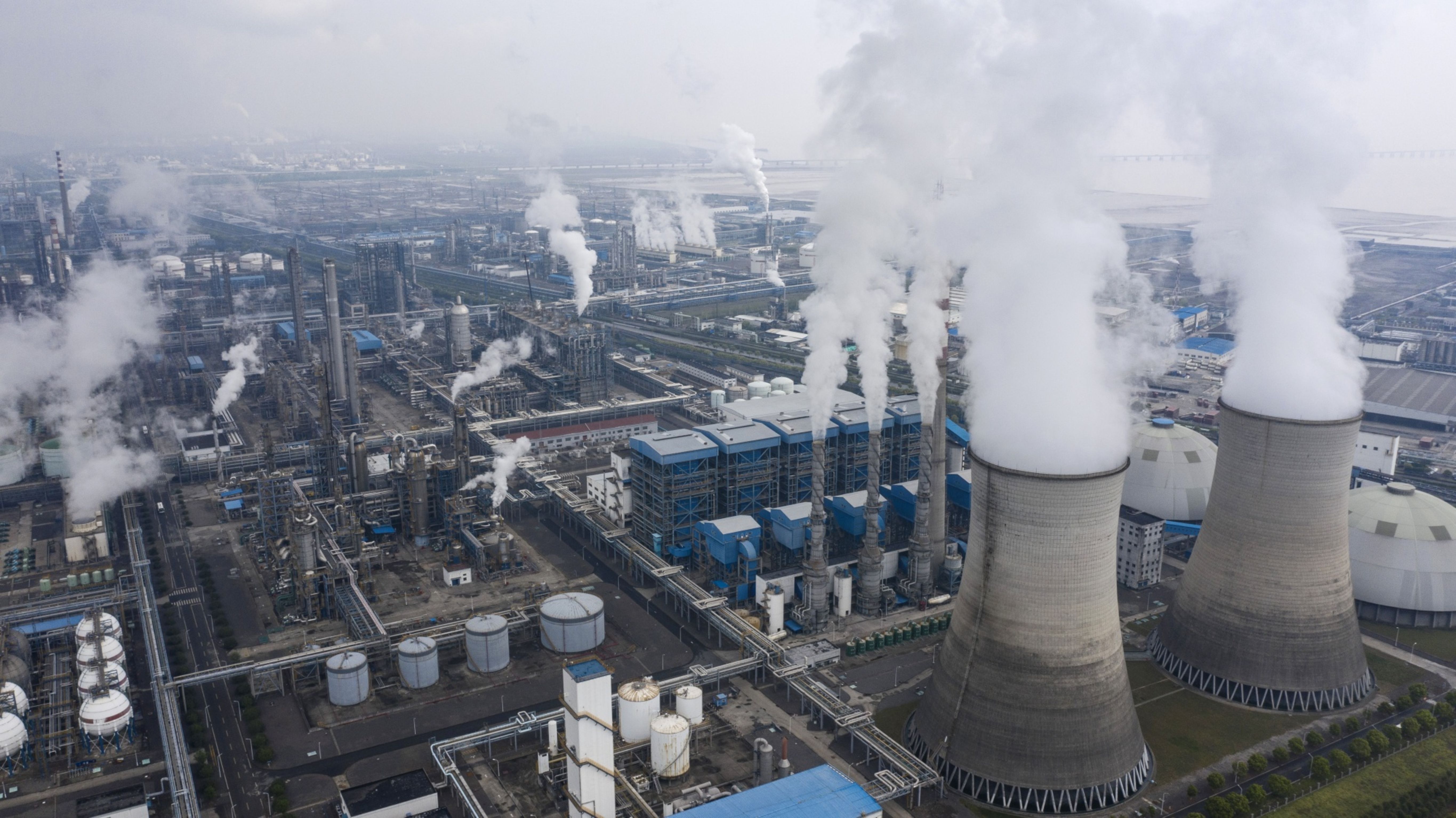 Emissions rise from smokestacks and cooling towers in China.