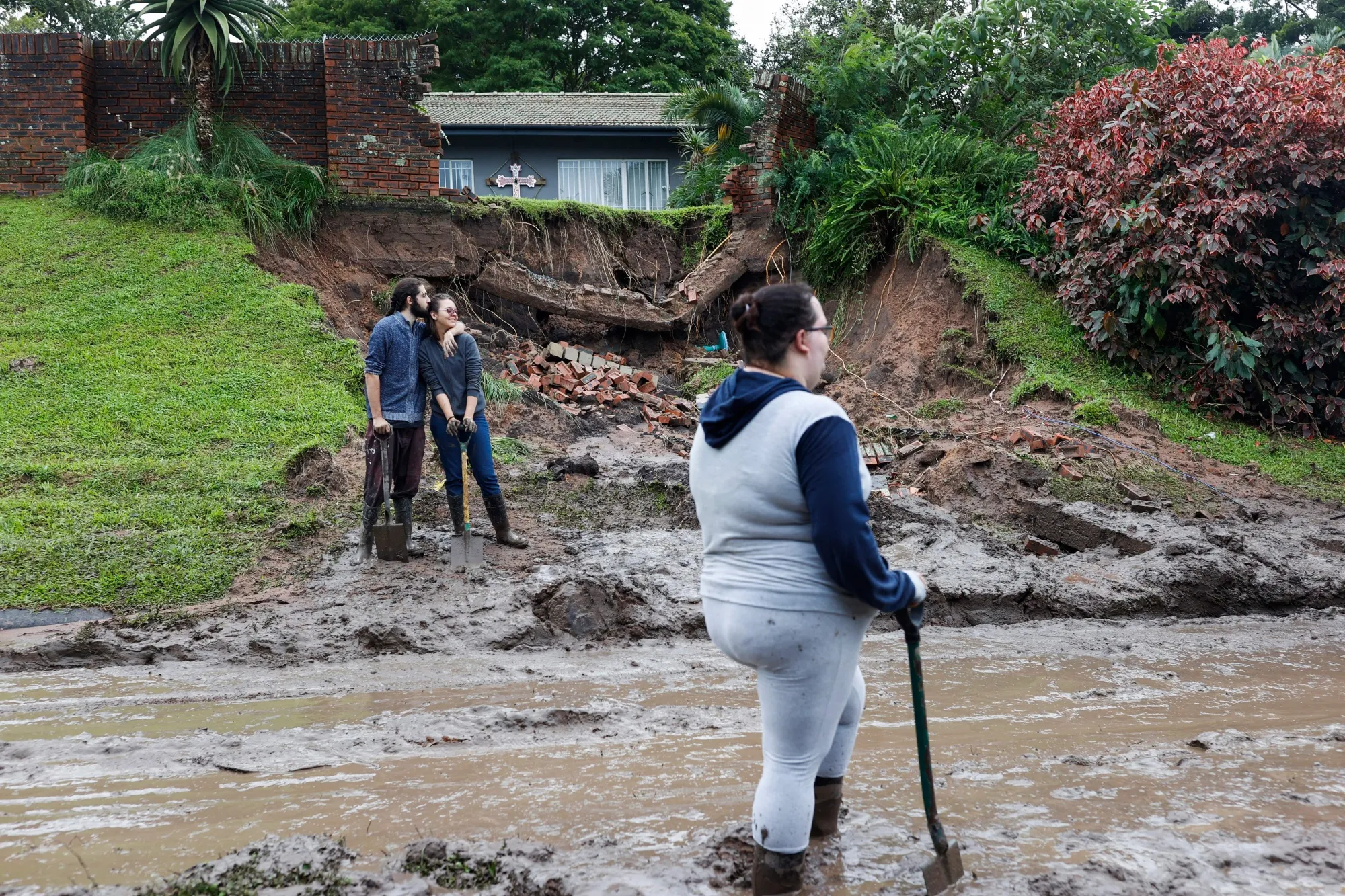 Residents next to a collapsed&nbsp;embankment following heavy rain near Durban, South Africa, on April 12.