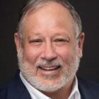Headshot of David E Rush "Dave"
