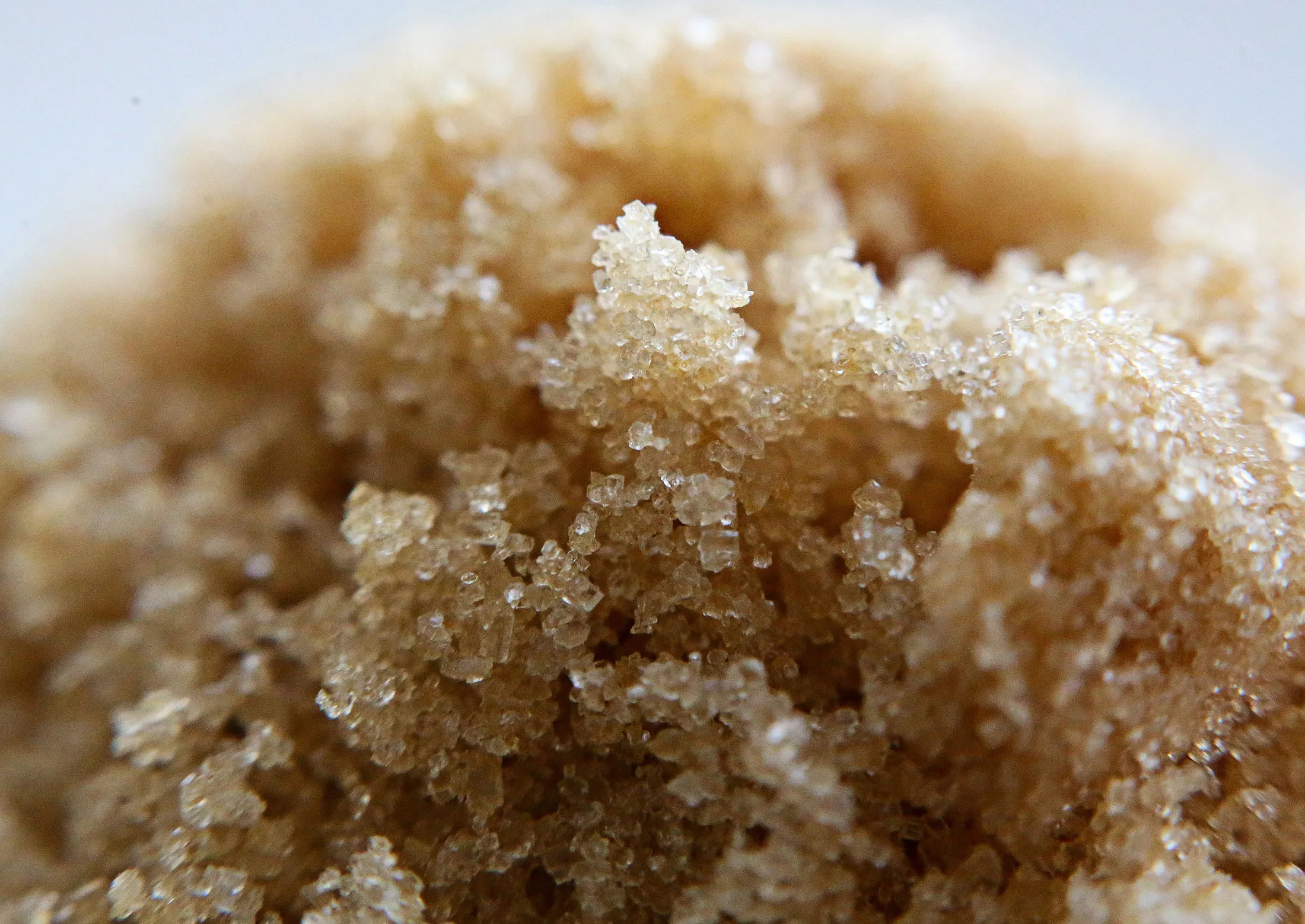 Yellow sugar granules sit during analysis in the laboratory at the Zainsk sugar plant, operated by ZAO Agrosila Group, in Zainsk, Russia, on Friday, Sept. 4. 2015. Raw-sugar futures turned a bit sweeter for bulls, climbing the most in almost four years on concerns that adverse weather may hurt crops in Brazil and India, the top producing countries.
