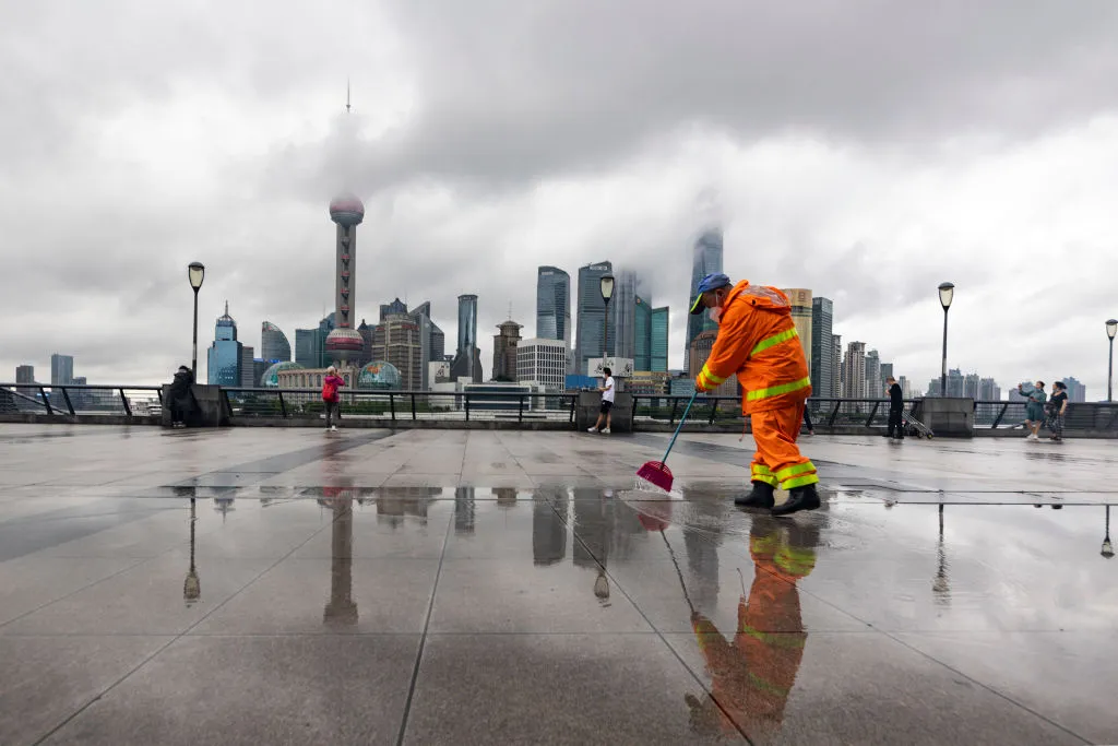 A cleaner in front of the financial district in&nbsp;Shanghai.