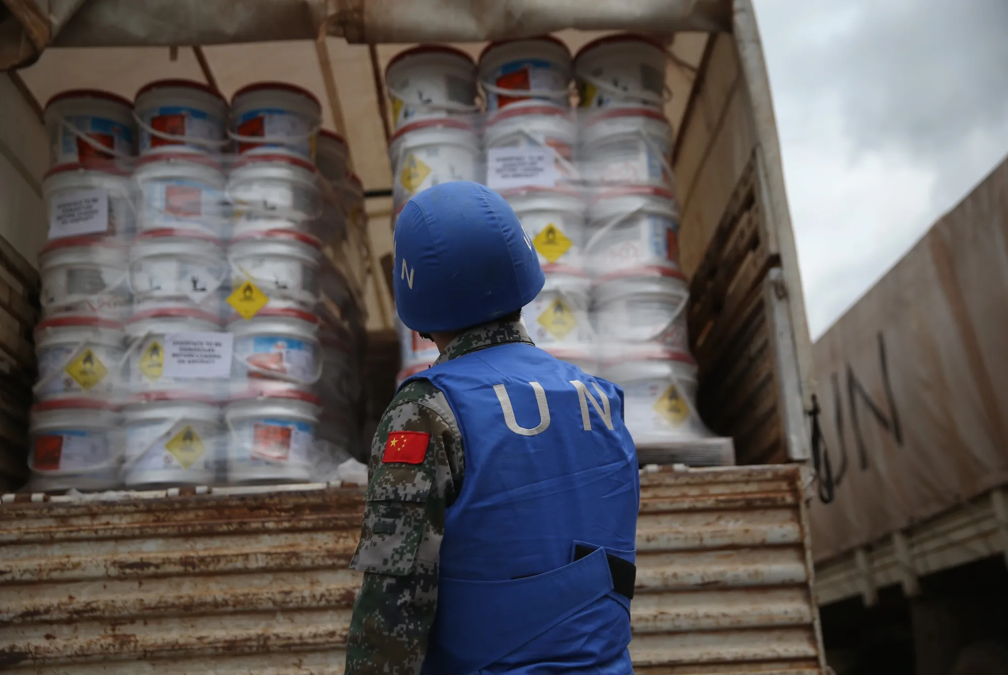 A UN soldier prepares a truckload of relief aid&nbsp;in Harbel, Liberia.