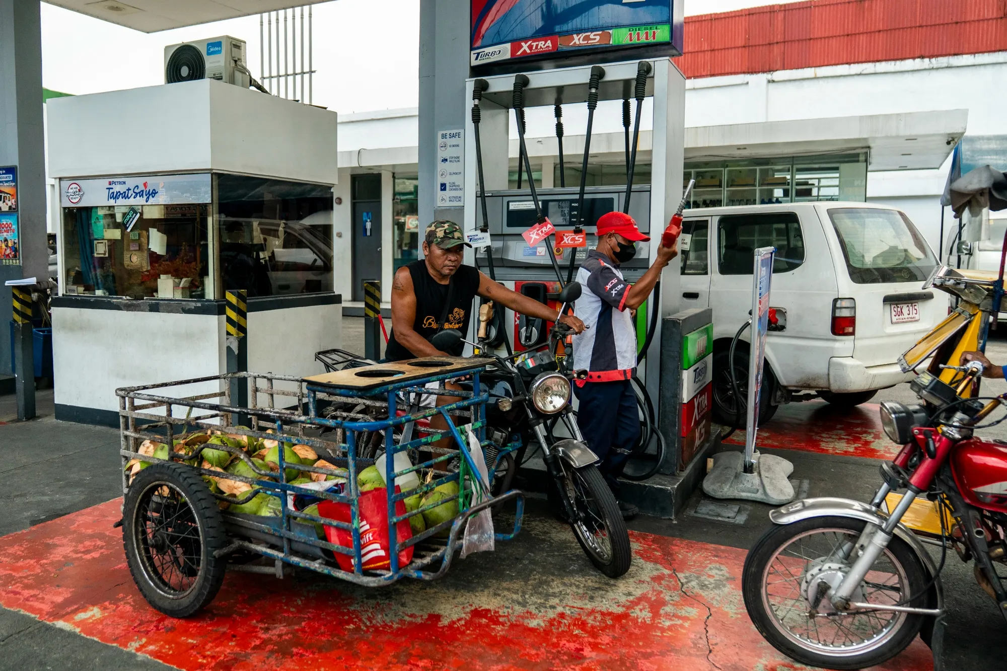 A motorist at a gas station in Mandaluyong, the Philippines.