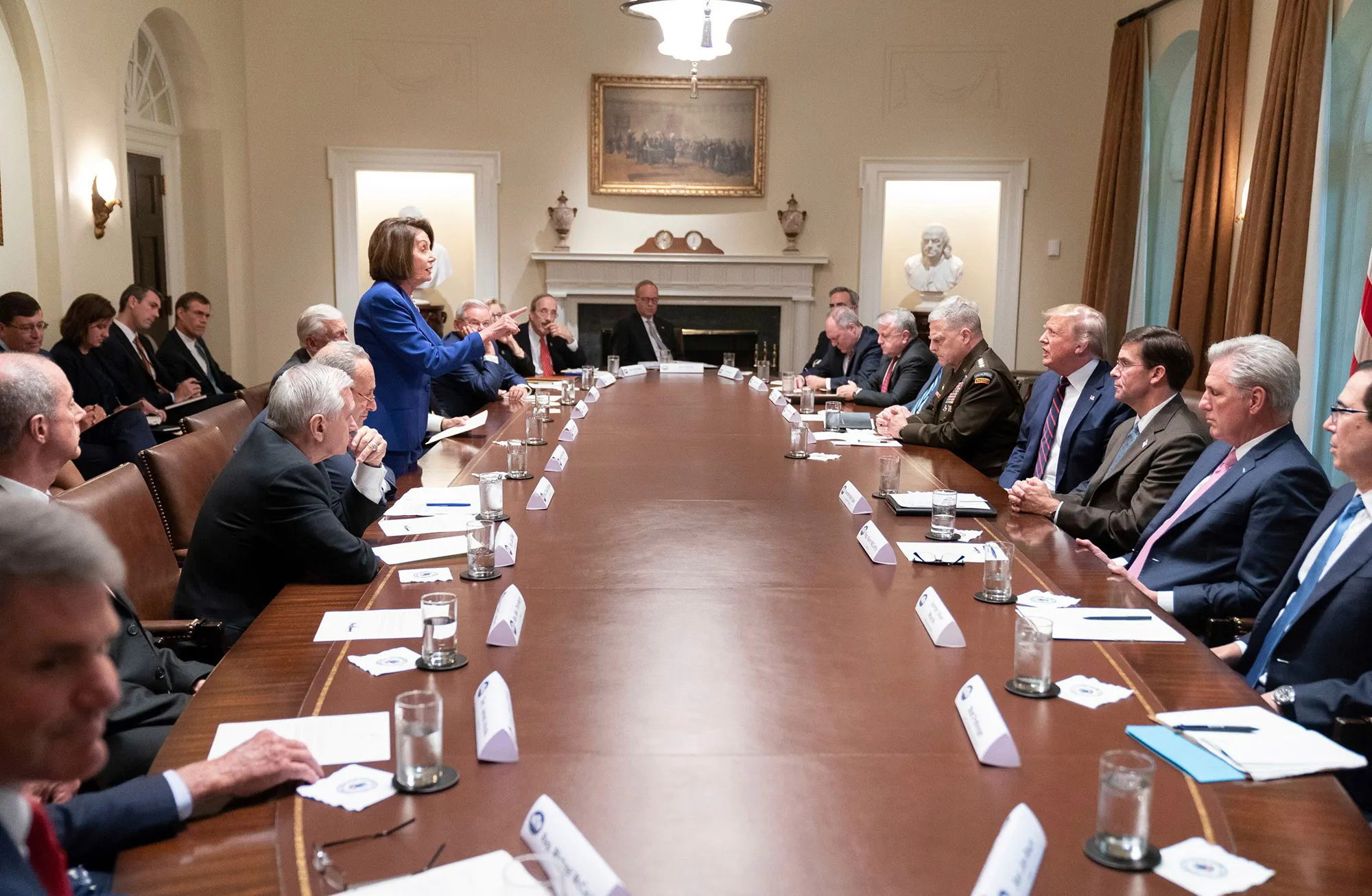 Pelosi stands during a meeting in the Cabinet Room of the White House in Oct. 2019