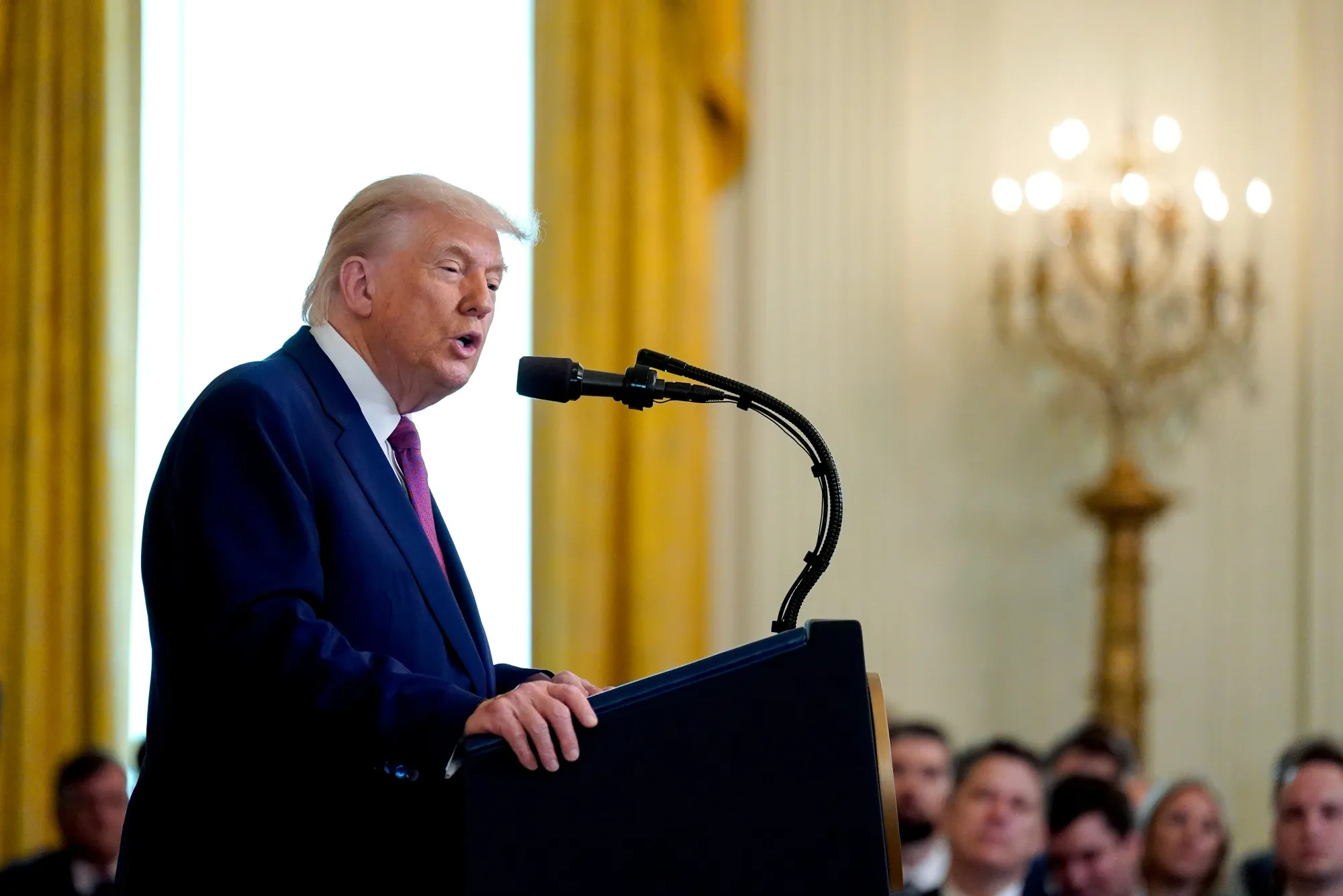 President Donald Trump speaks during a bill signing ceremony in the East Room of the White House on June 12.