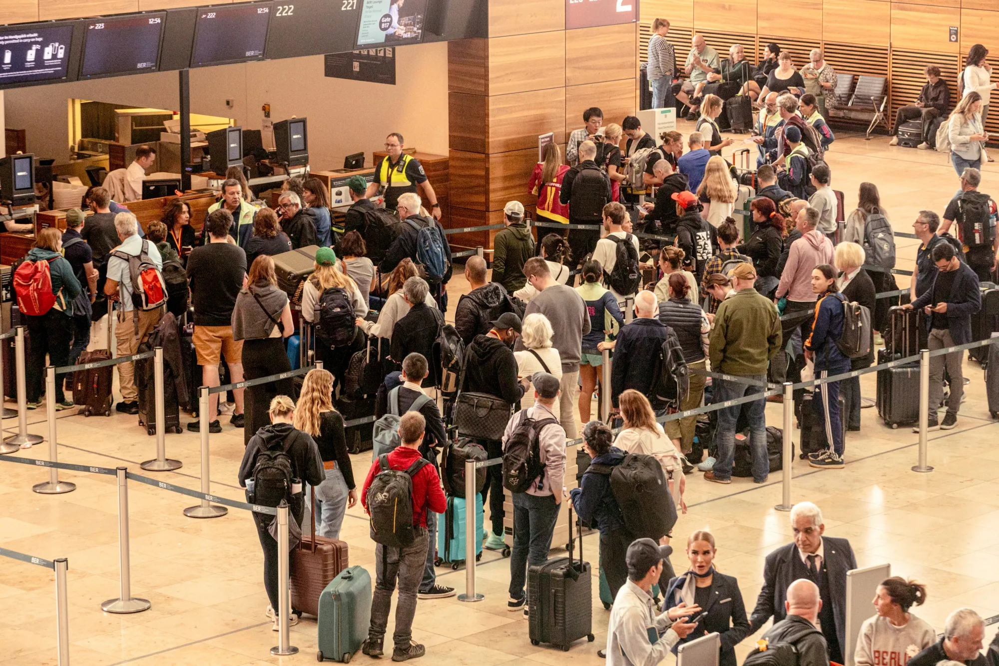 Passengers at check-in desks, after a cyberattack caused an outage to key airline check-in systems, at Berlin Brandenburg Airport, on Sept. 22.