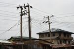 Power cables above solar panels mounted on the roof of a building in Lagos, Nigeria.