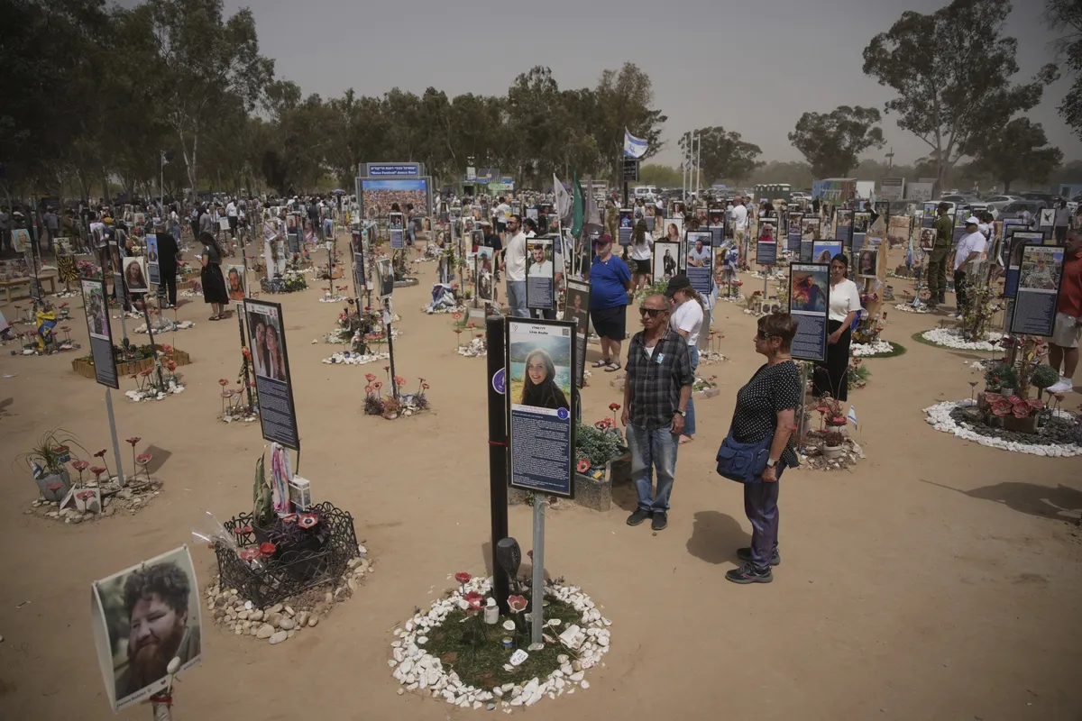 People observe two minutes of silence to mark Israel’s annual Remembrance Day at the site of the Oct. 7 attack on the Nova music festival in southern Israel, on April 30.