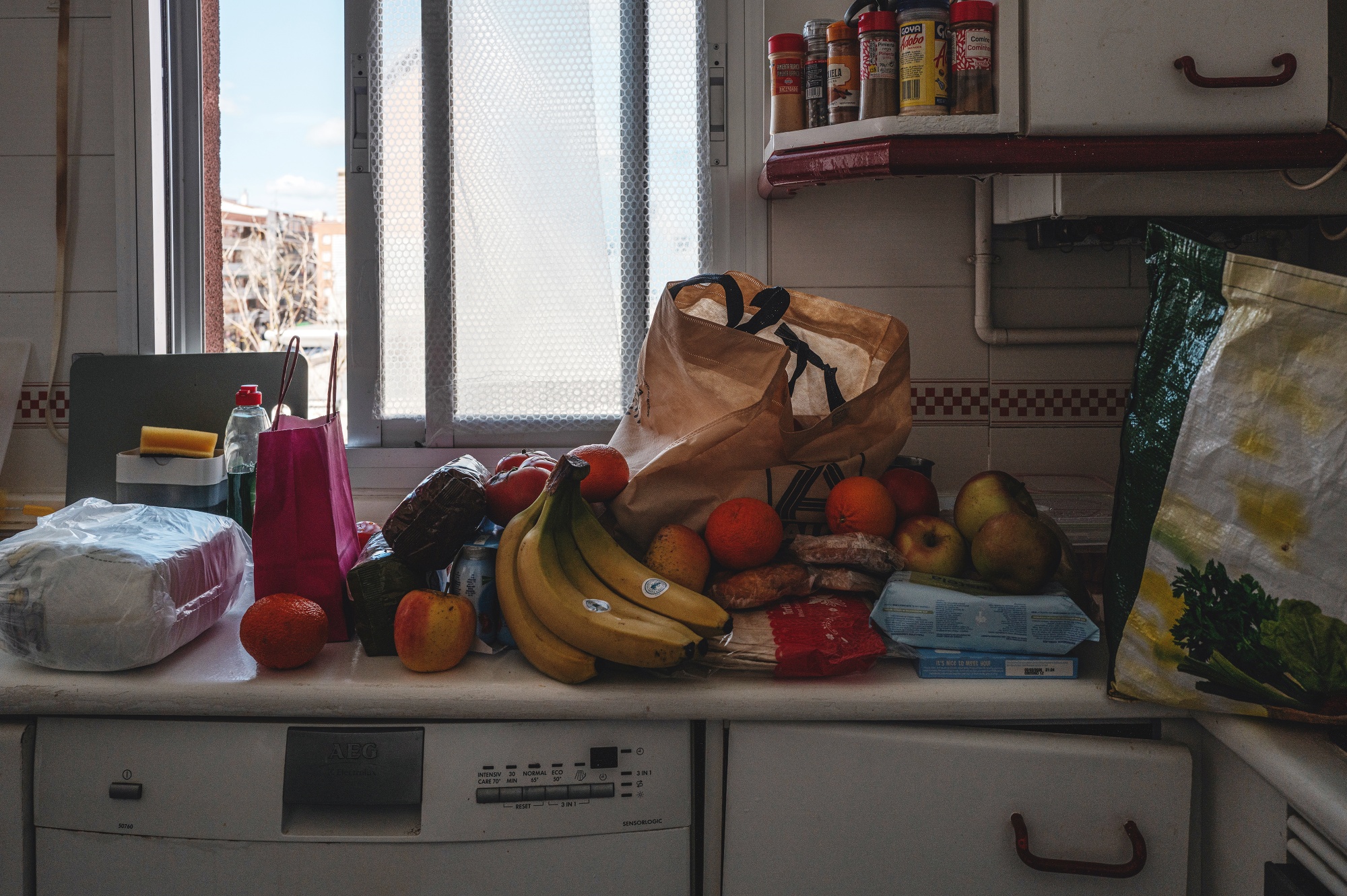 Food from the Madrina Foundation in the kitchen of the family’s home in Madrid, Spain, on Friday, March 13, 2026. with heating too expensive to switch on, bubble wrap on the windows is an attempt to keep the property warm.