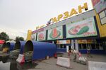 A customer exits an Arzan wholesale supermarket store in Almaty, Kazakhstan
