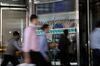 Pedestrians pass in front of Morgan Stanley headquarters in New York, U.S., on Thursday, July 12, 2018. Morgan Stanley is scheduled to release earnings figures on July 18.