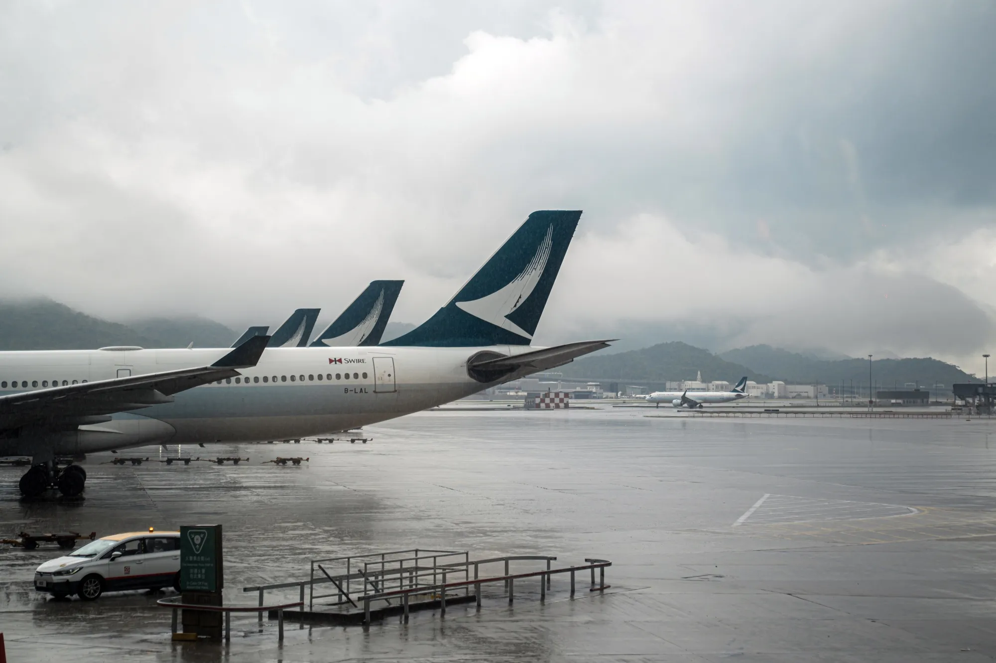 Cathay Pacific passenger jets at Hong Kong International Airport.
